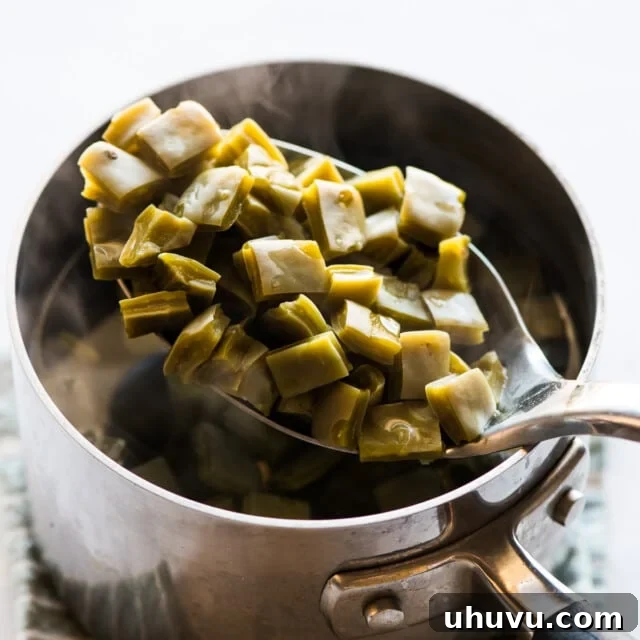 Cooked nopales on a spoon.