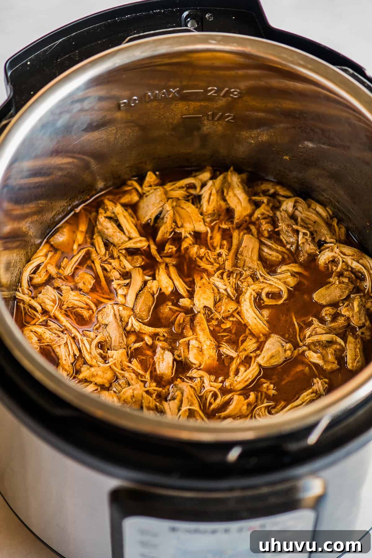 Speedy Instant Pot Chicken Tacos 4 Shredded cooked chicken inside the instant pot.