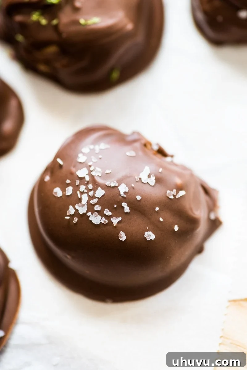 These chocolate covered almond butter balls are made with only 3 ingredients and are the perfect healthy dessert! All you need is almond butter, coconut flour and chocolate chips! They're like a healthy reese's cup!