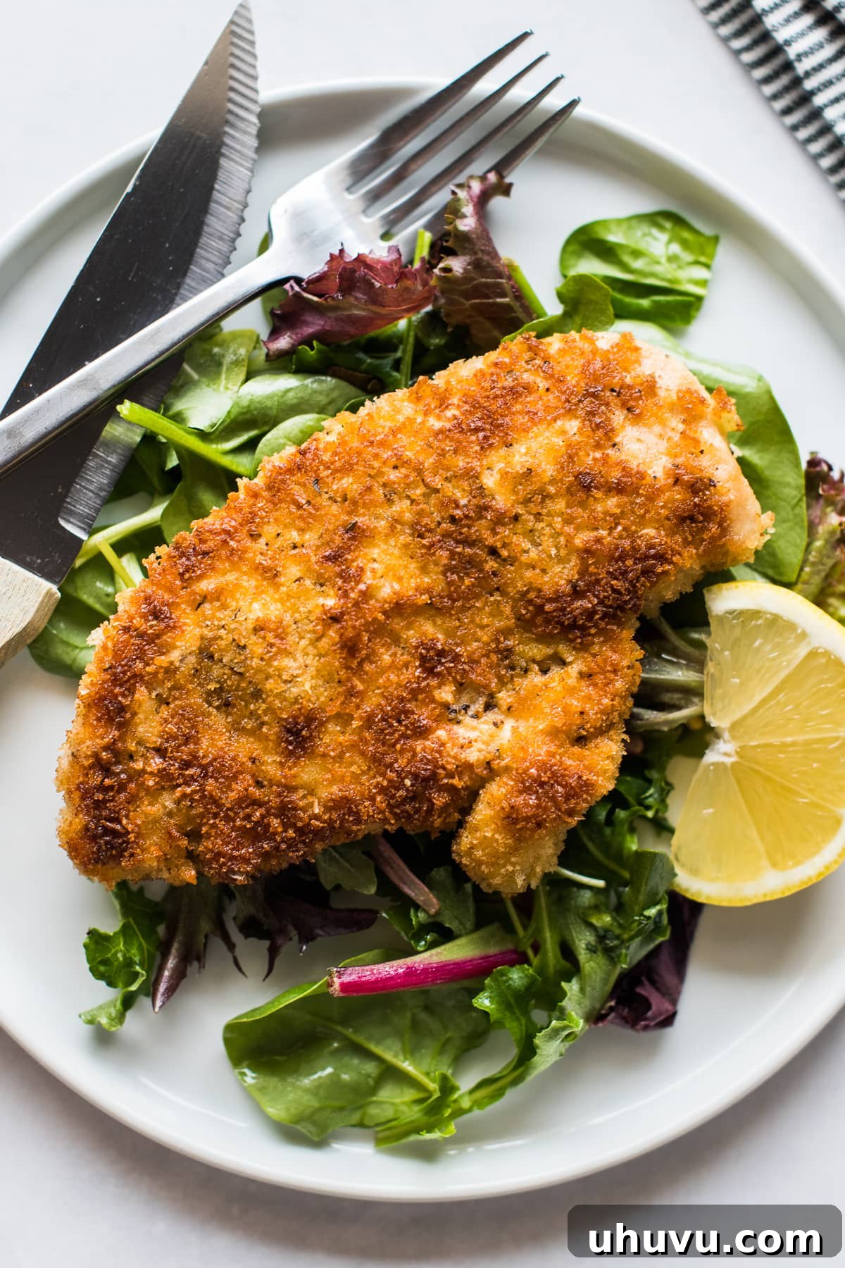 Milanesa de Pollo, or Chicken Milanese, is a popular dish in many Mexican households and restaurants. Made from seasoned breaded chicken cutlets that are pan-fried to perfection, it's ready in only 30 minutes and is a family dinner favorite that's quick, easy, and delicious!