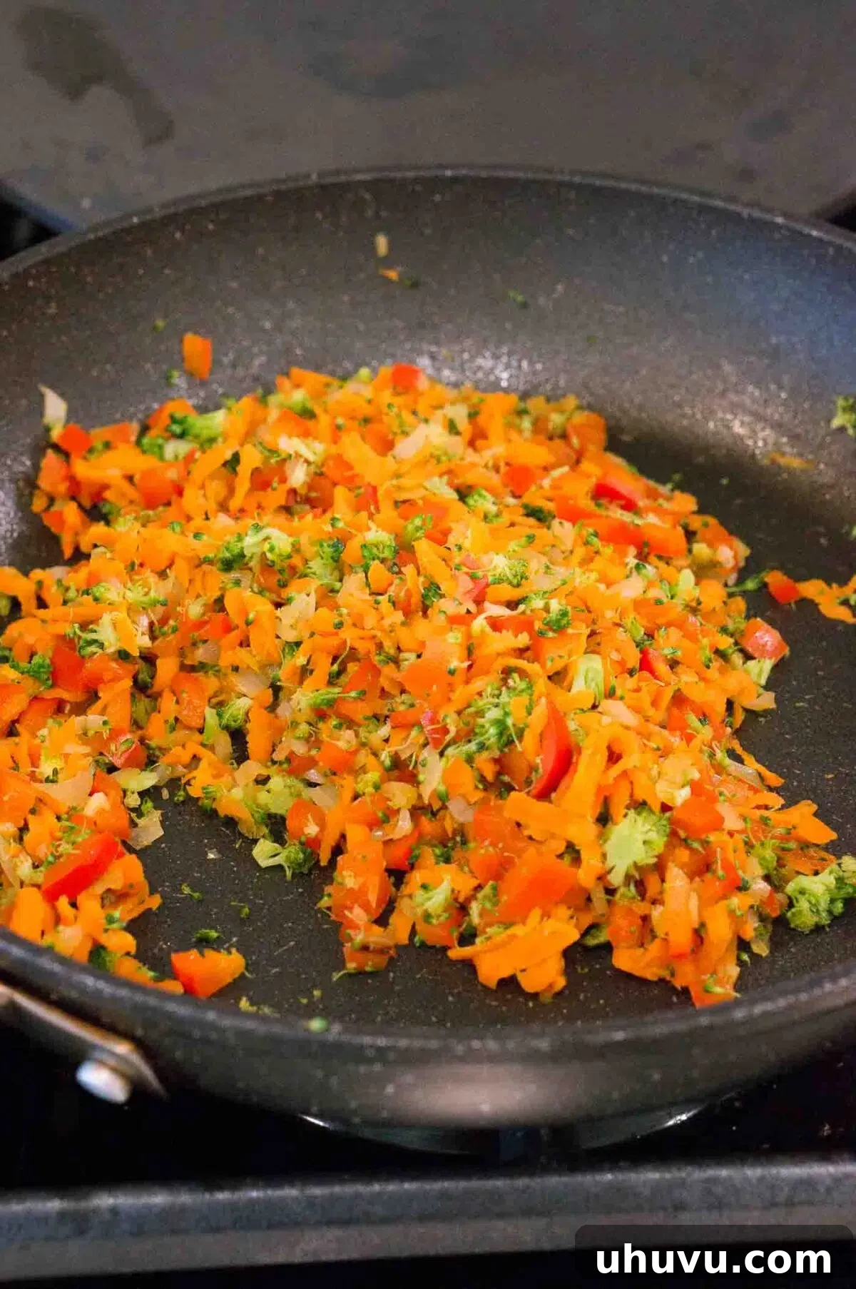 sauteed vegetables in a skillet for egg muffins
