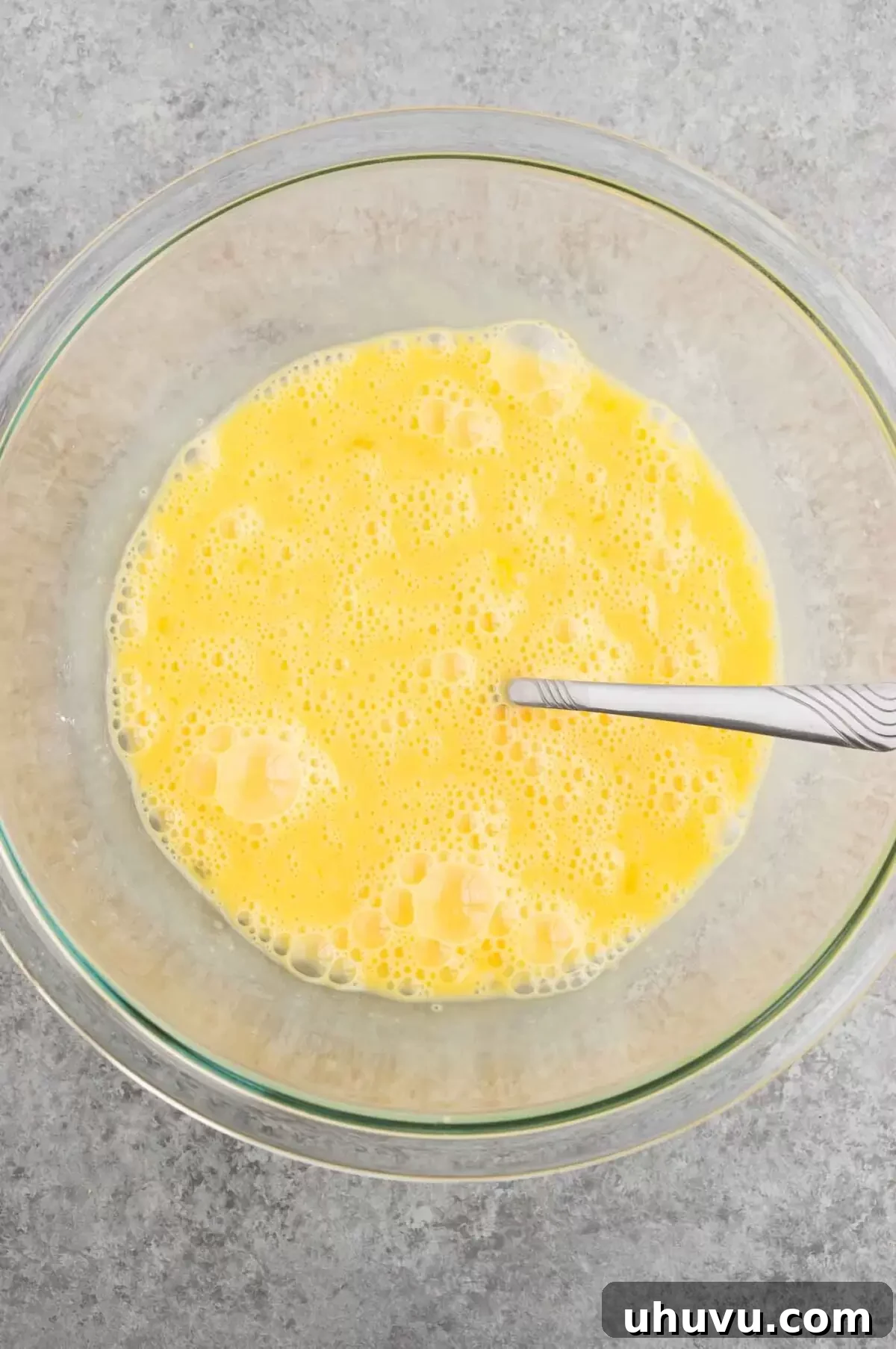 whisked eggs in a bowl ready for mixing with other ingredients