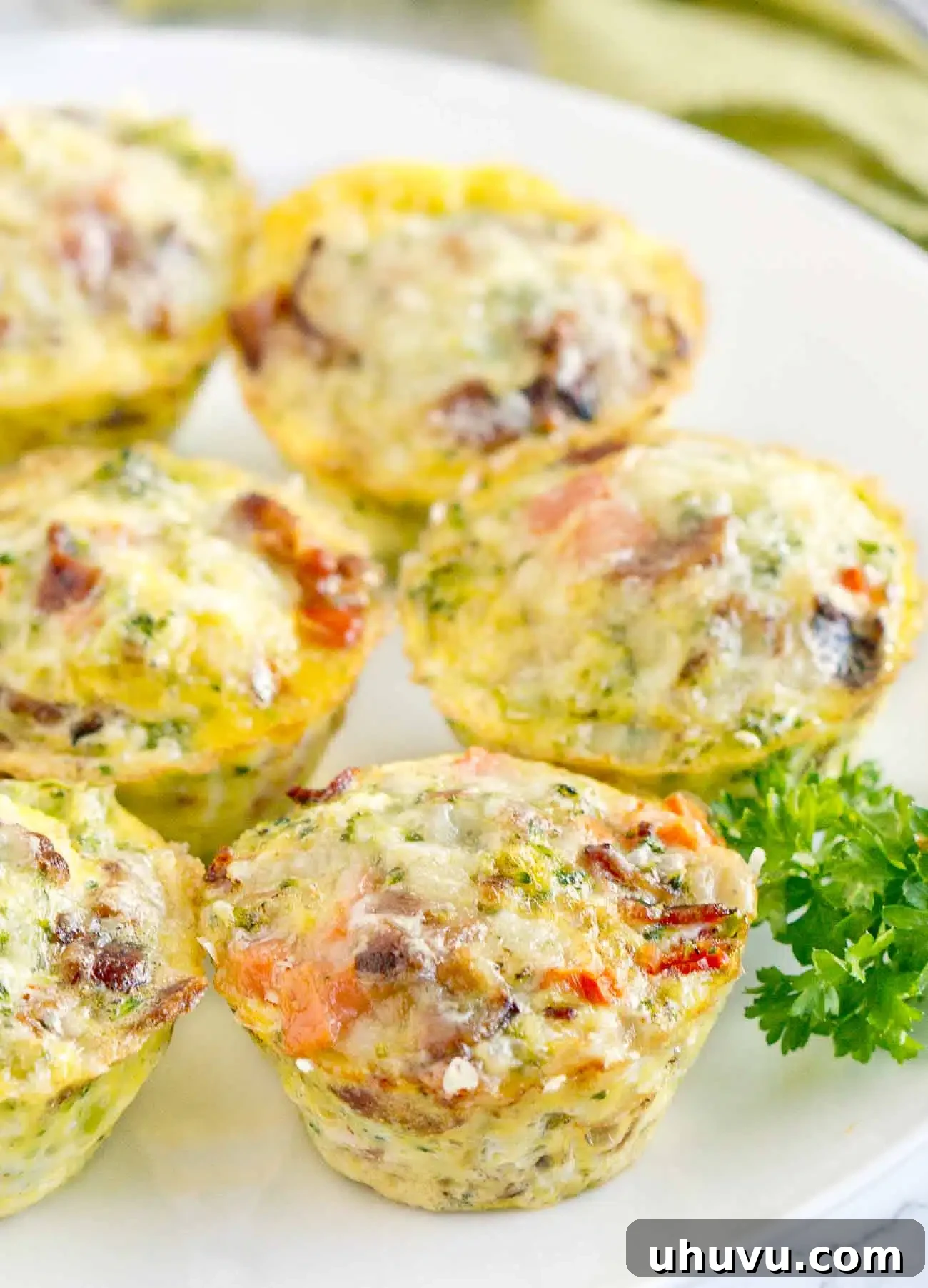 Easy Egg Bites 10 Close-up of baked breakfast egg muffins on a serving board, ready to eat