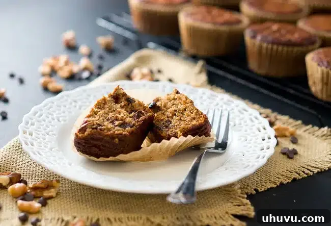 Banana Muffins on a plate with a fork, ready to be enjoyed