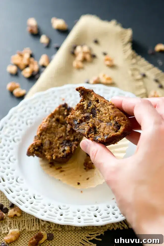 Ultimate Banana Chocolate Chip Muffins 4 Banana Nut Muffin on a plate, showcasing its fluffy texture