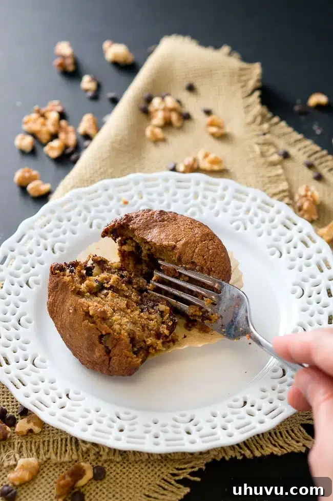 Paleo Banana Nut Chocolate Muffins, a close-up of a muffin with visible chocolate chips and nuts