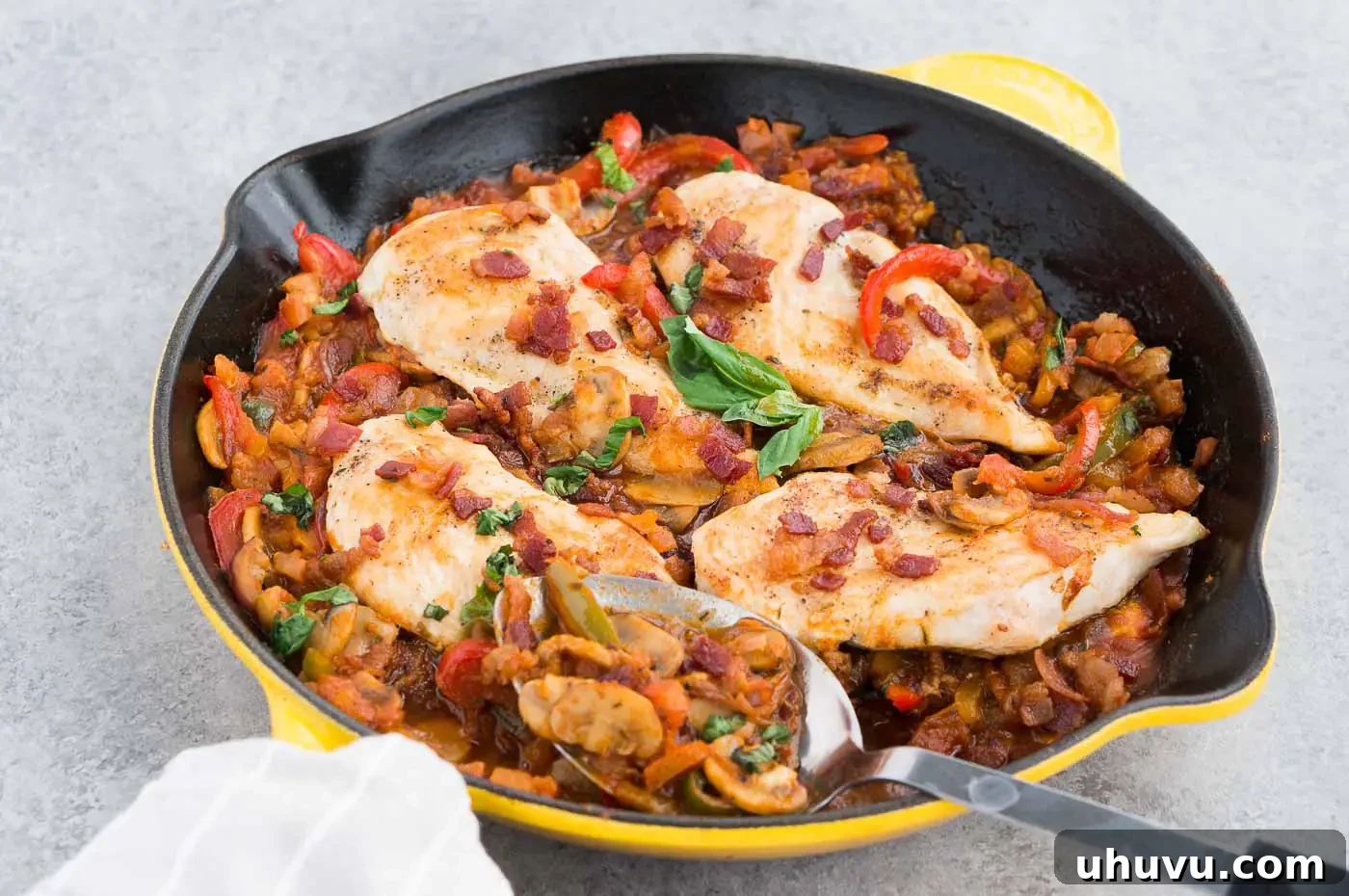 Vibrant Italian chicken and vegetables simmering in a large skillet