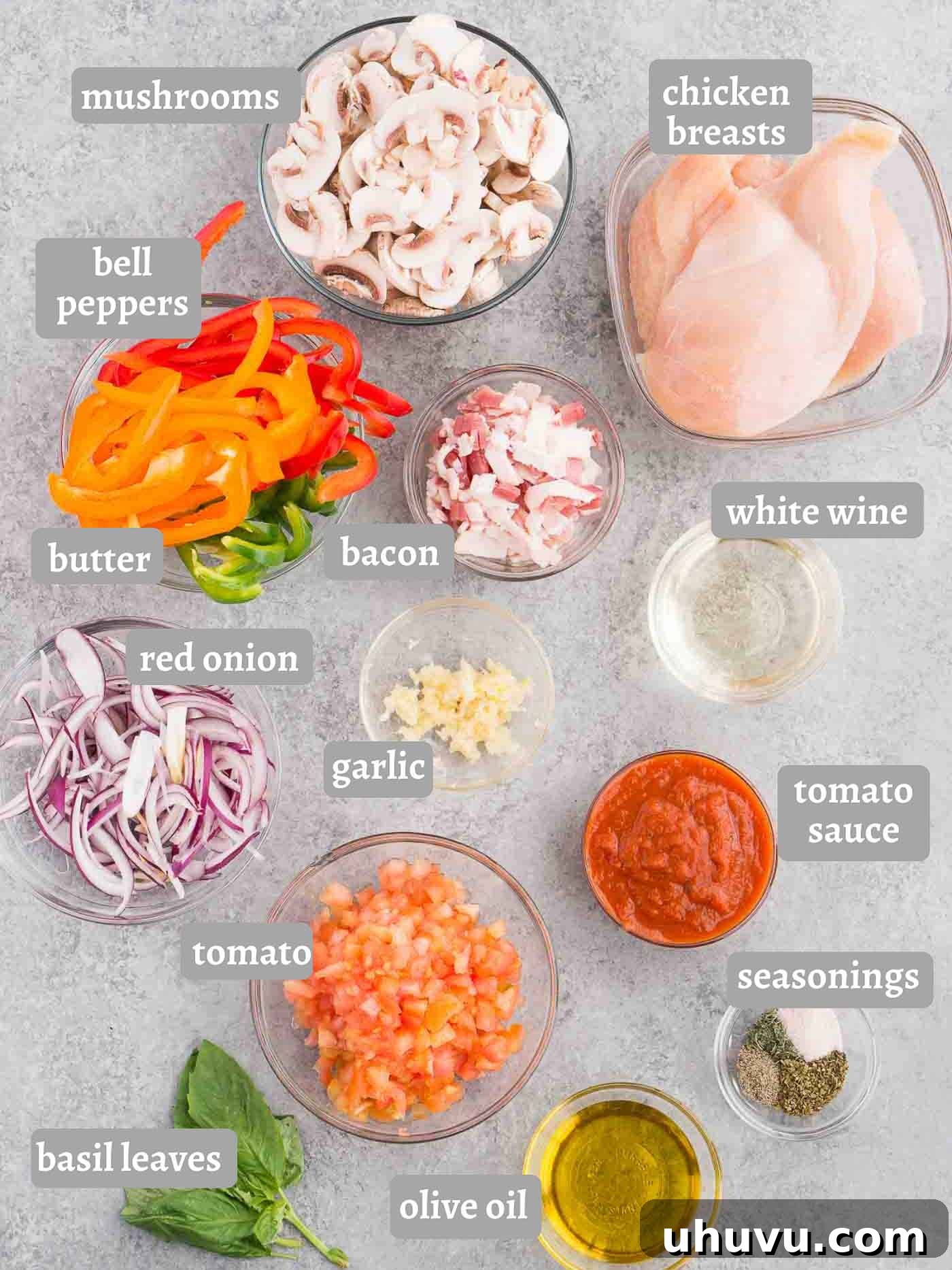 Braised Chicken in Tomato Herb Sauce 4 Arrangement of chicken cacciatore ingredients including chicken, bacon, vegetables, and herbs