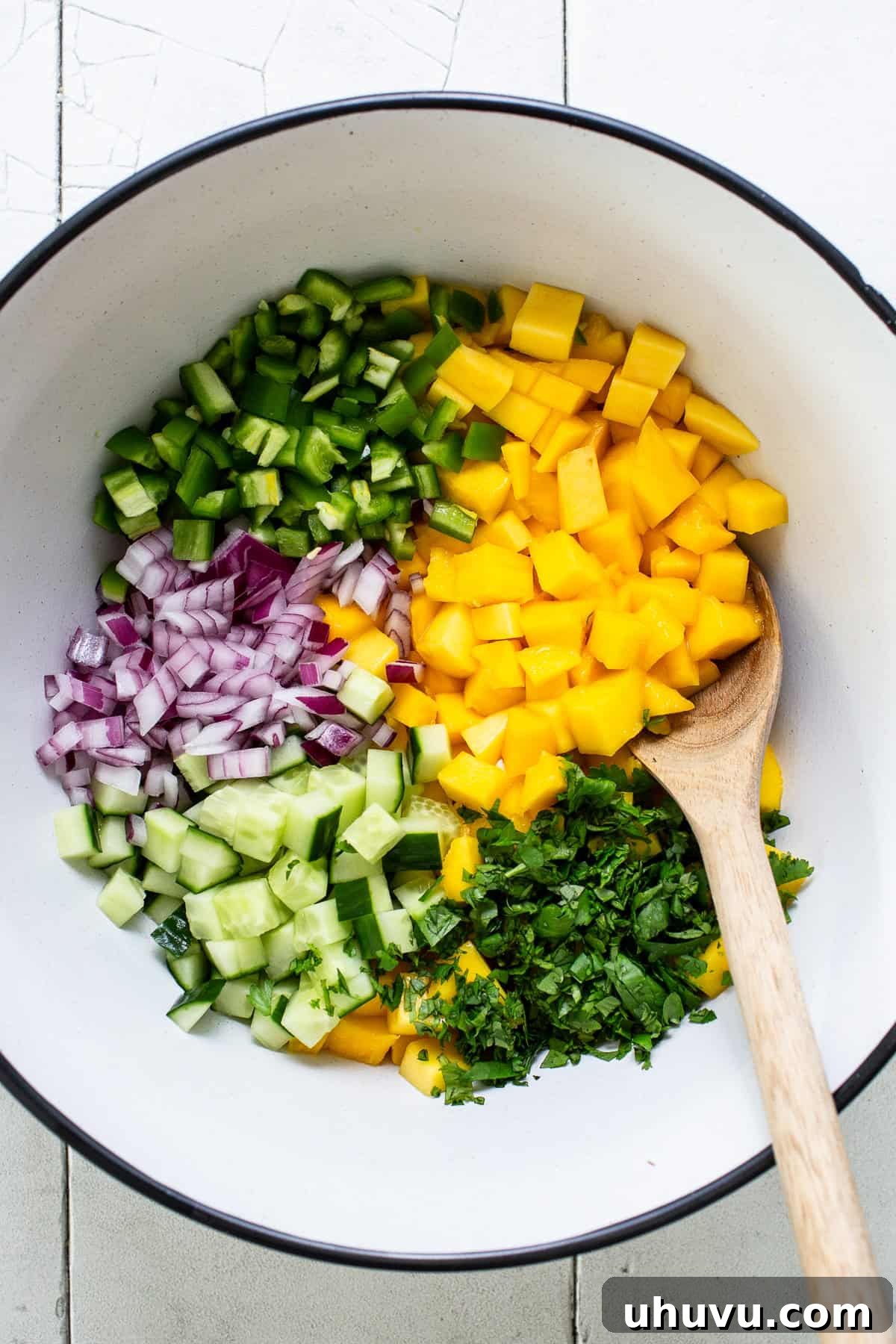 Tropical Mango Medley 4 All diced ingredients for mango salsa are combined in a medium-sized bowl, ready for a gentle toss.