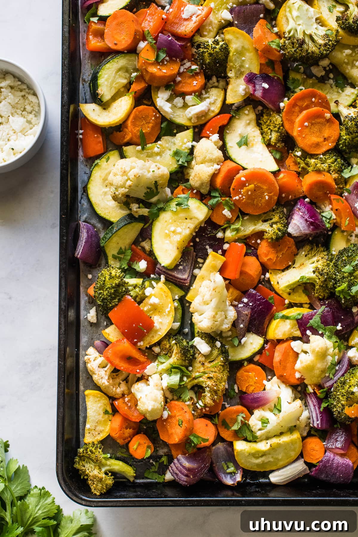 Fiesta Roasted Vegetables 6 Mexican vegetables roasted on a sheet pan topped with lime juice, cotija cheese, and cilantro.