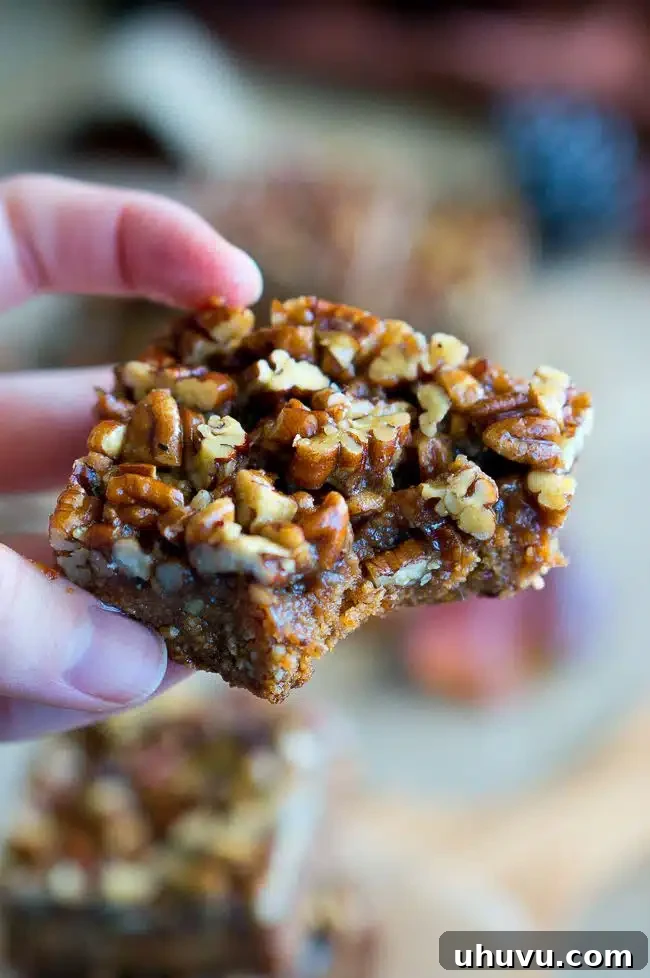 Close-up of the gooey pecan topping on the Paleo Pecan Pie Bars.