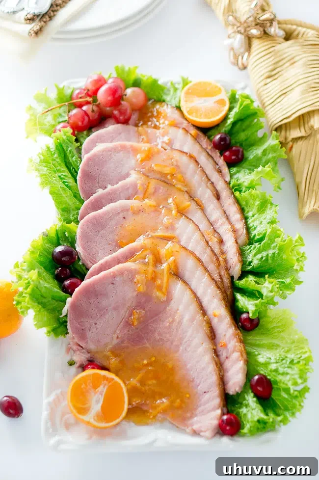 Another view of the glazed ham centerpiece with fresh fruit garnishes.