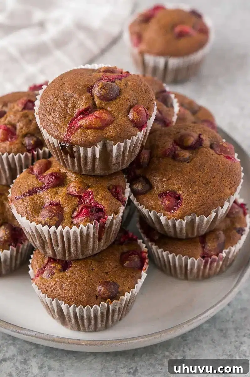 A plate of freshly baked orange cranberry muffins