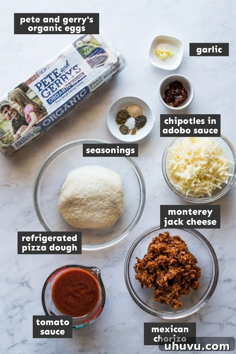 Morning Fiesta Pizza 3 Fresh ingredients for Mexican Breakfast Pizza laid out on a wooden table, including pizza dough, chorizo, eggs, cheese, and spices.