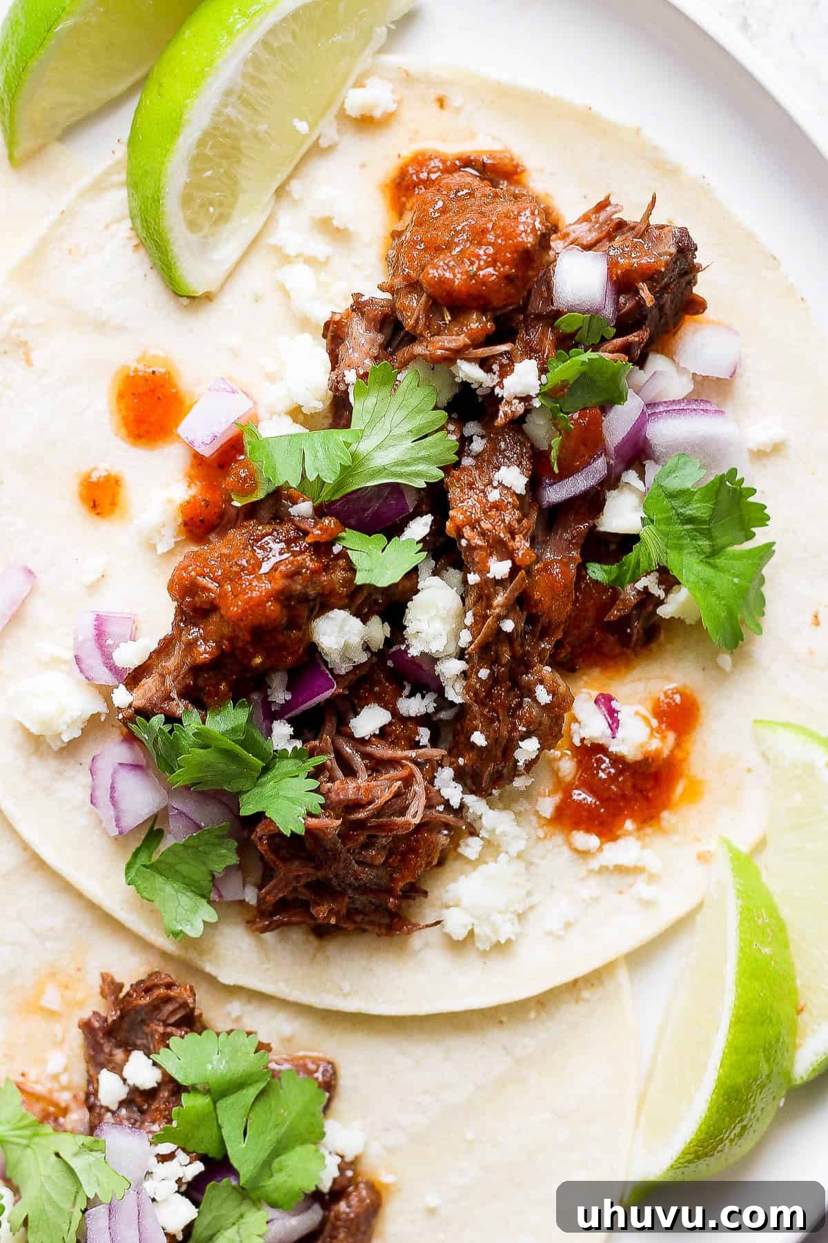 Smoky Chipotle Shredded Beef 11 Beef tinga served as a taco with toppings