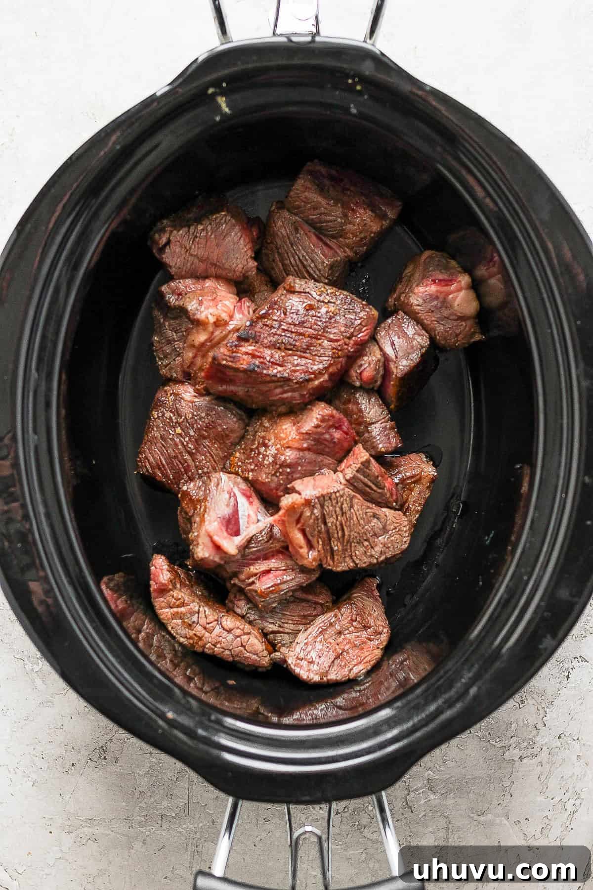 Smoky Chipotle Shredded Beef 8 Cooked beef inside the crockpot