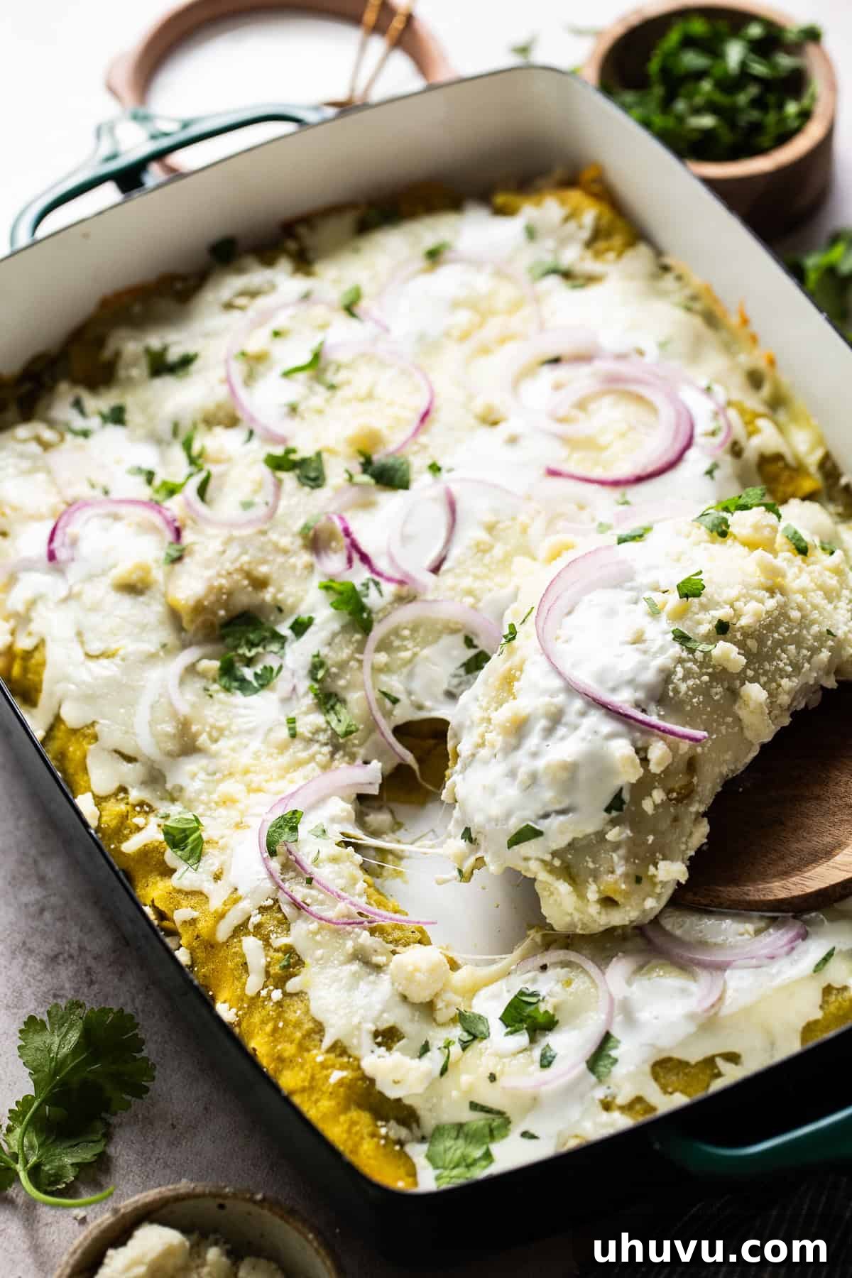 Zesty Green Enchiladas 7 Ready to eat enchialdas verdes with sour cream, cilantro,, and red onions.