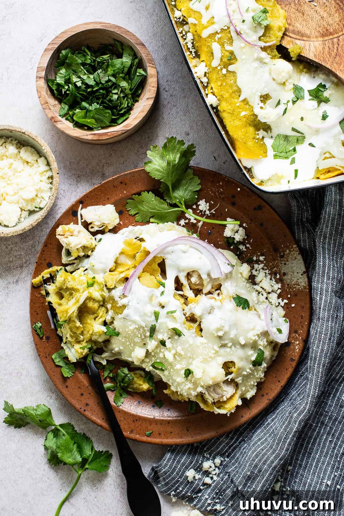 Zesty Green Enchiladas 8 Plated enchiladas verdes topped with cilantro, onions, and Mexican crema.