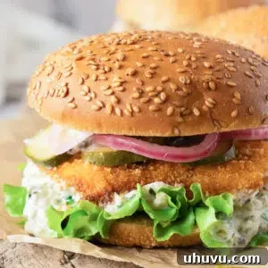 fish burger with tartar sauce and fixings