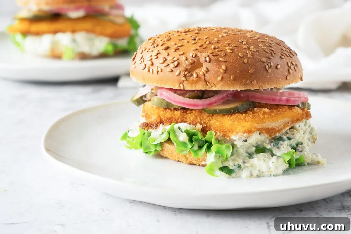 Delicious fried fish fillet for a burger on a plate
