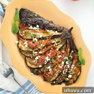 Close-up of a perfectly roasted eggplant fan with feta cheese