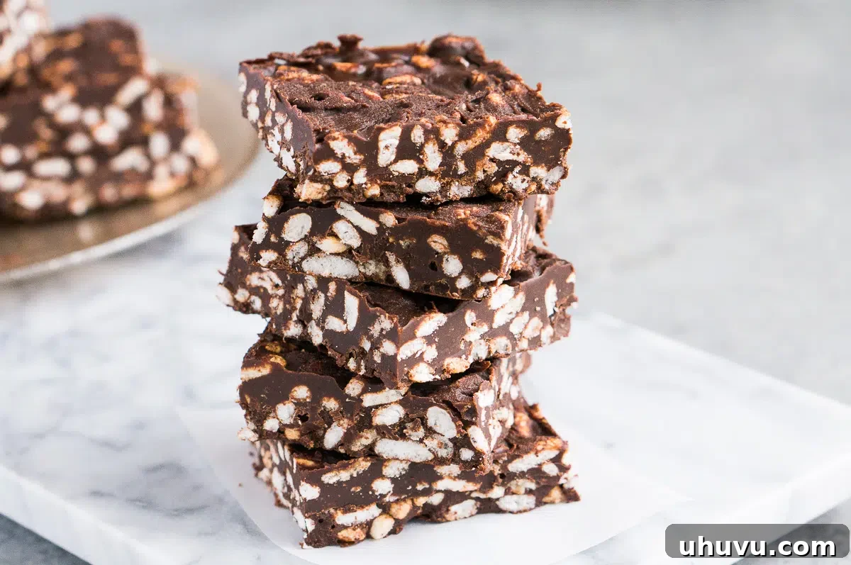 A vibrant display of finished chocolate crunch bars arranged beautifully on a wooden serving board