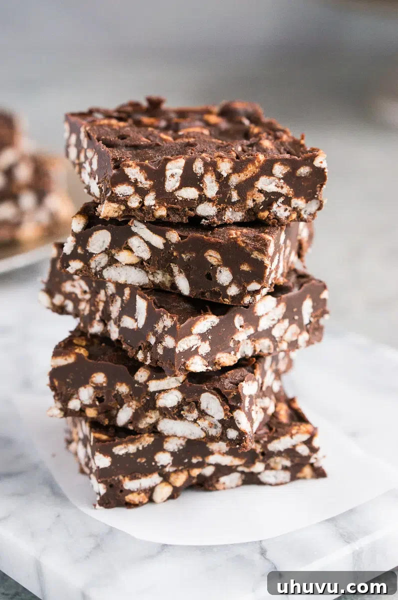 Close-up shot of the crispy, textured interior of a homemade chocolate crunch bar, showcasing its layers