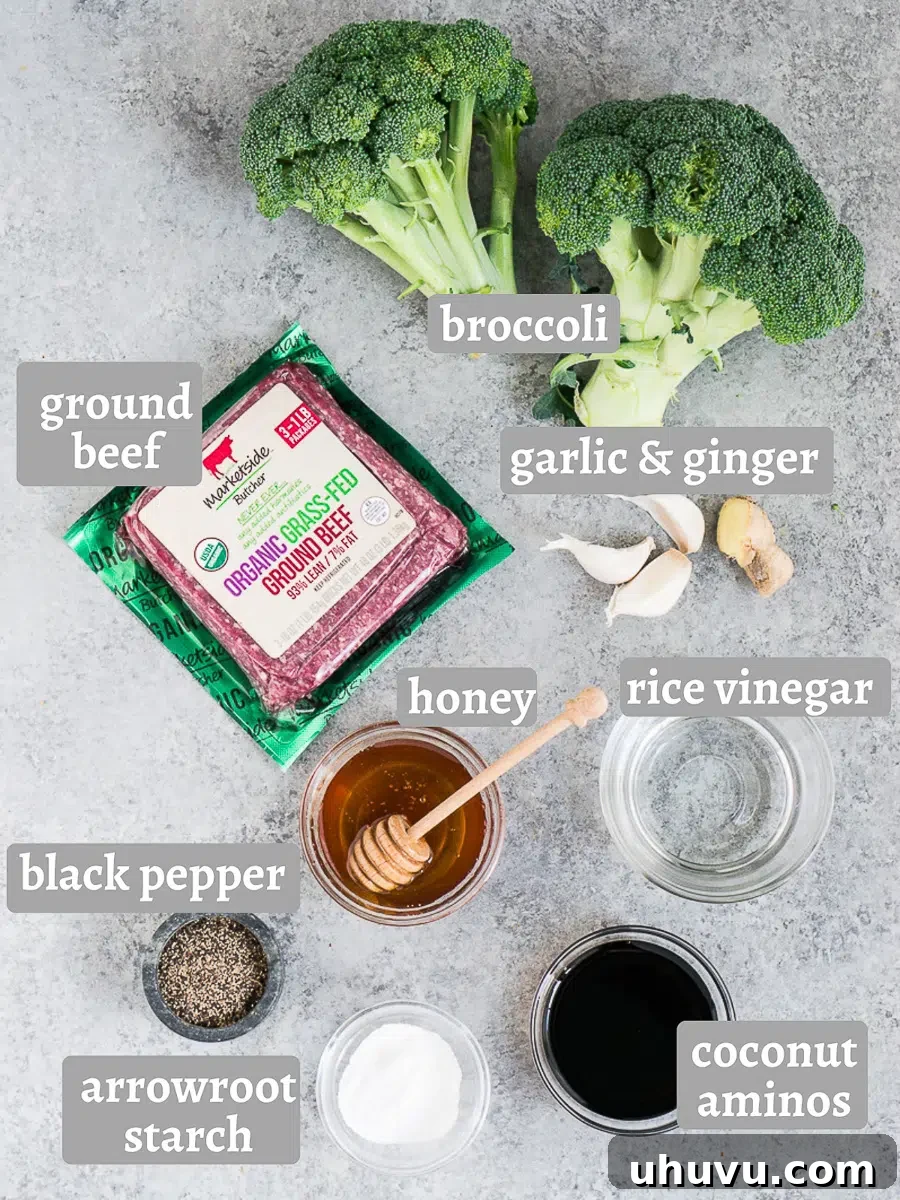 ingredients for ground beef and broccoli stir fry including fresh broccoli, ground beef, ginger, garlic, and sauce components