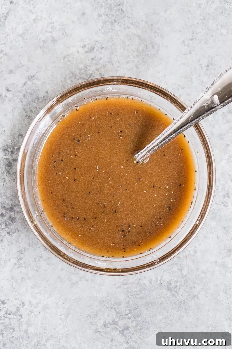 close up of stir fry sauce ingredients being mixed in a bowl