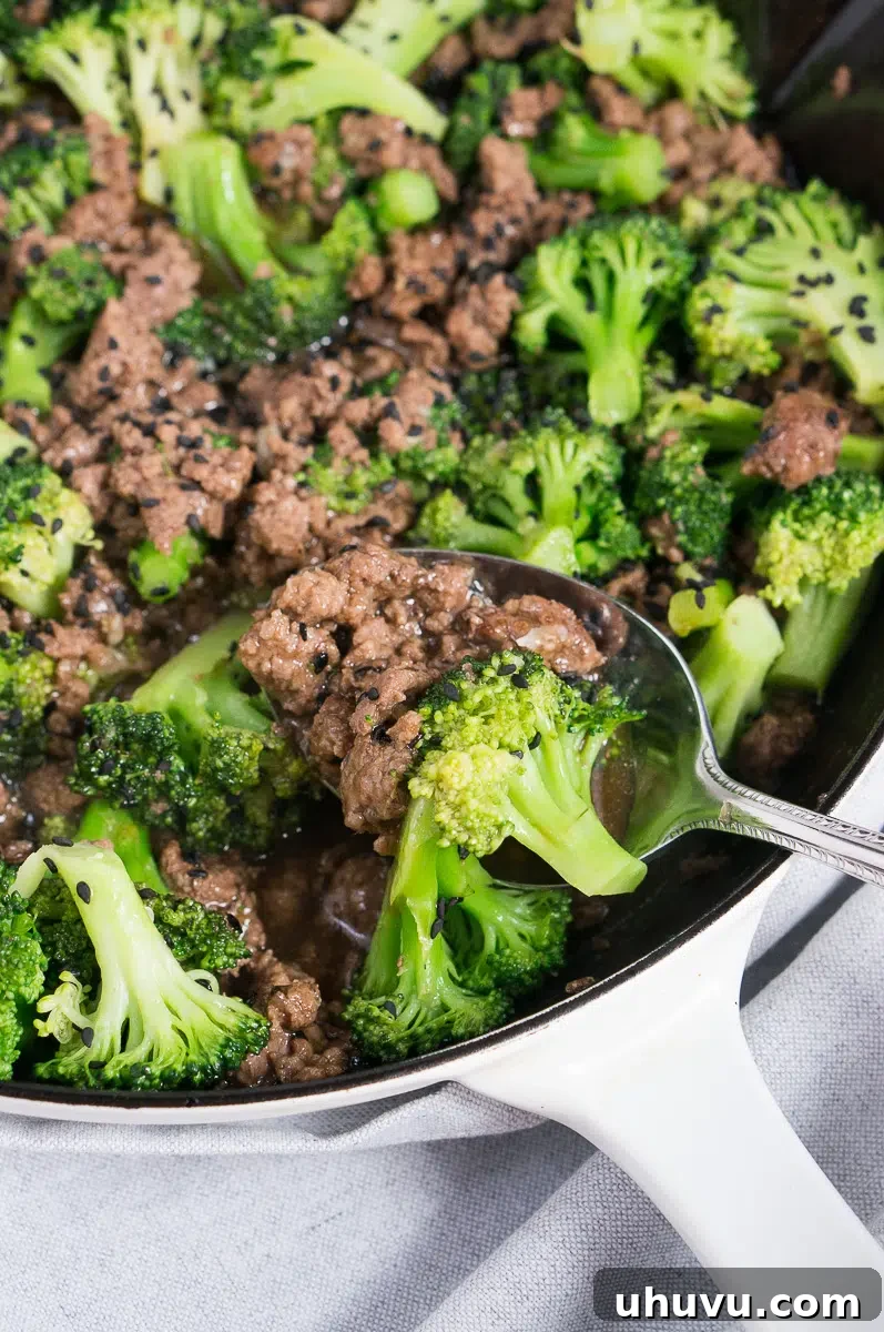 close up of ground beef and broccoli stir fry with rice in a bowl