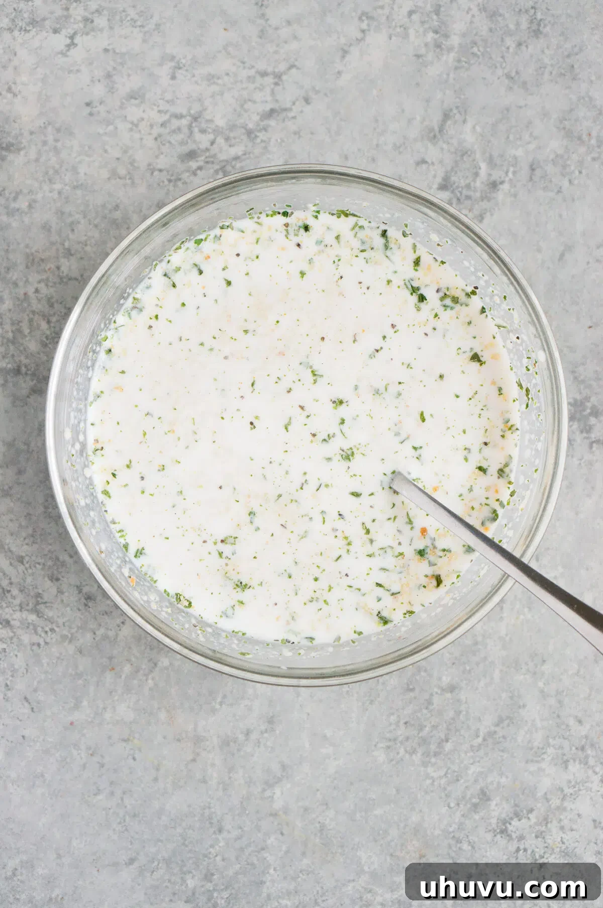 Breadcrumbs soaking in milk in a bowl