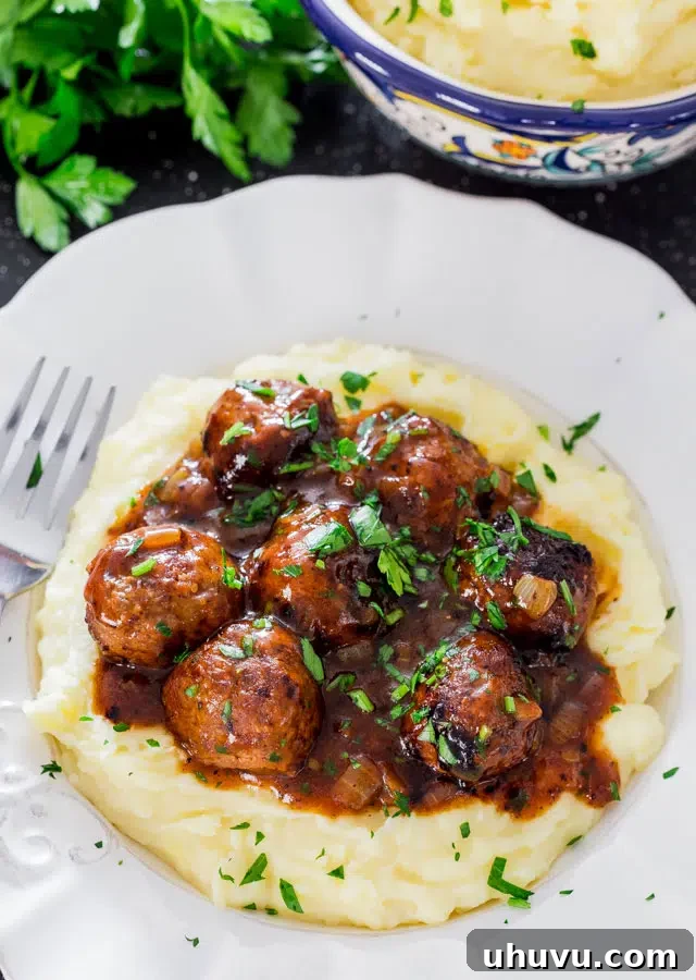 15 Cozy Comfort Meals Made Simple 15 Salisbury Steak Meatballs with Gravy and Mashed Potatoes - Homestyle comfort food with savory meatballs and rich gravy.