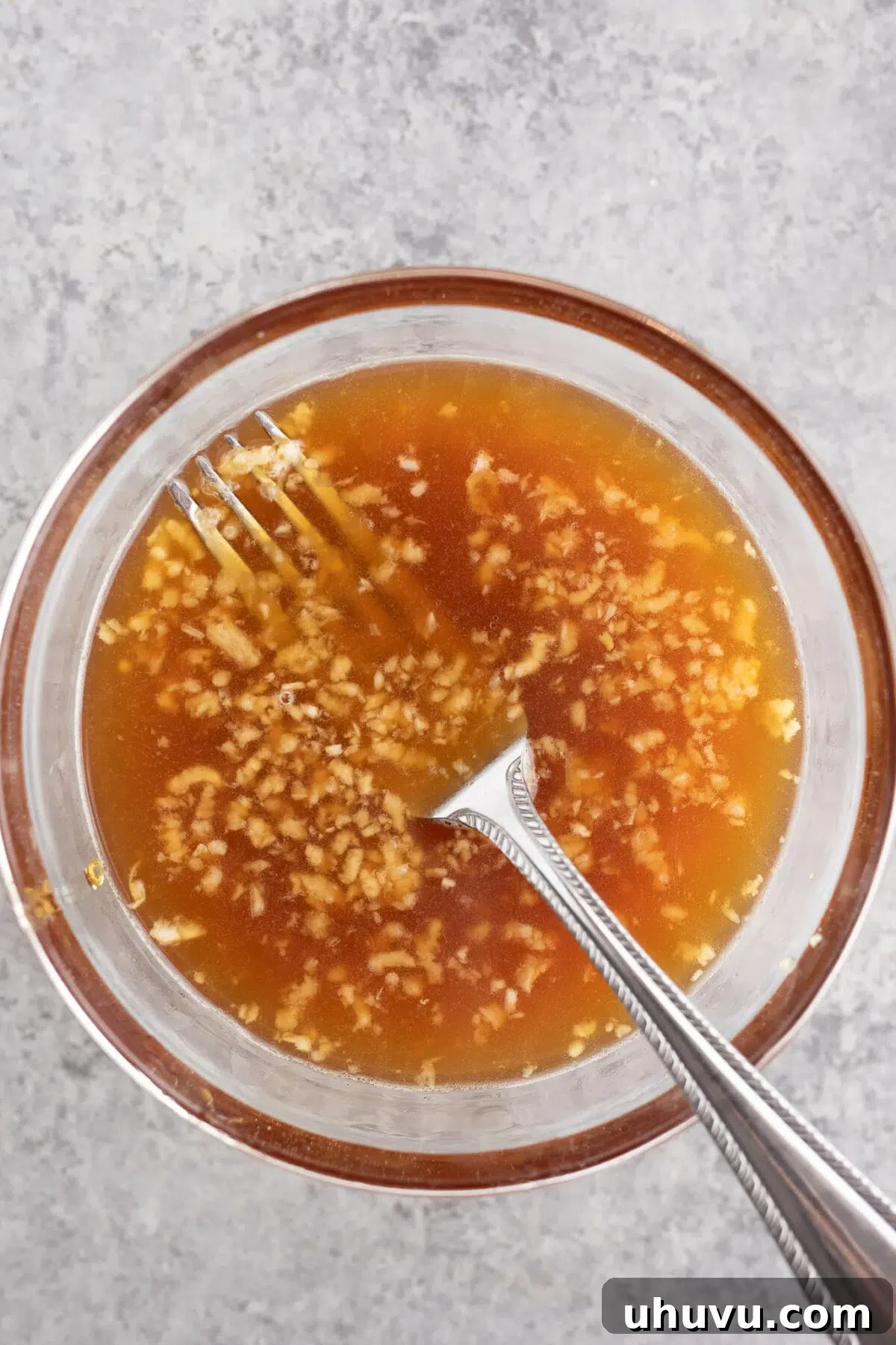 mixing honey soy sauce ingredients in a bowl for the sauce
