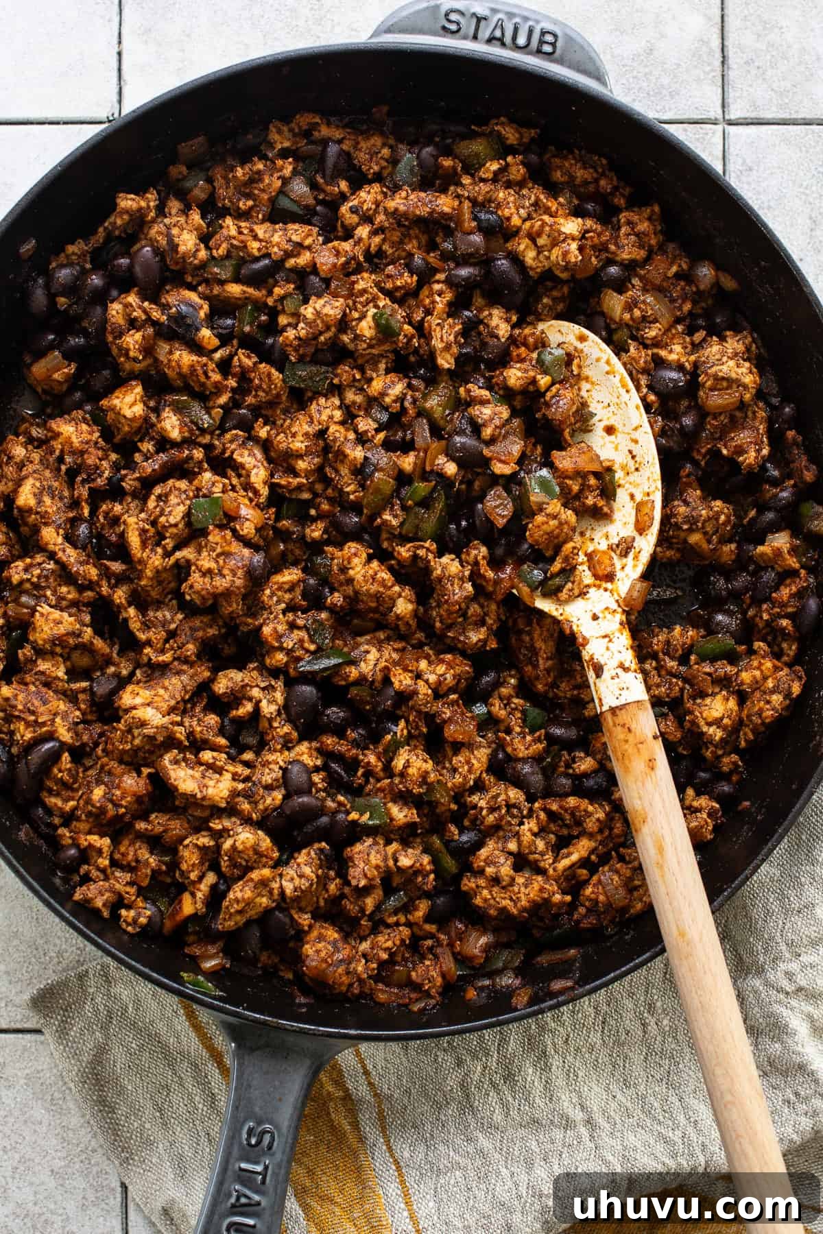 Hearty Spaghetti Squash Bake 6 Cooked ground chicken and black beans in a skillet.