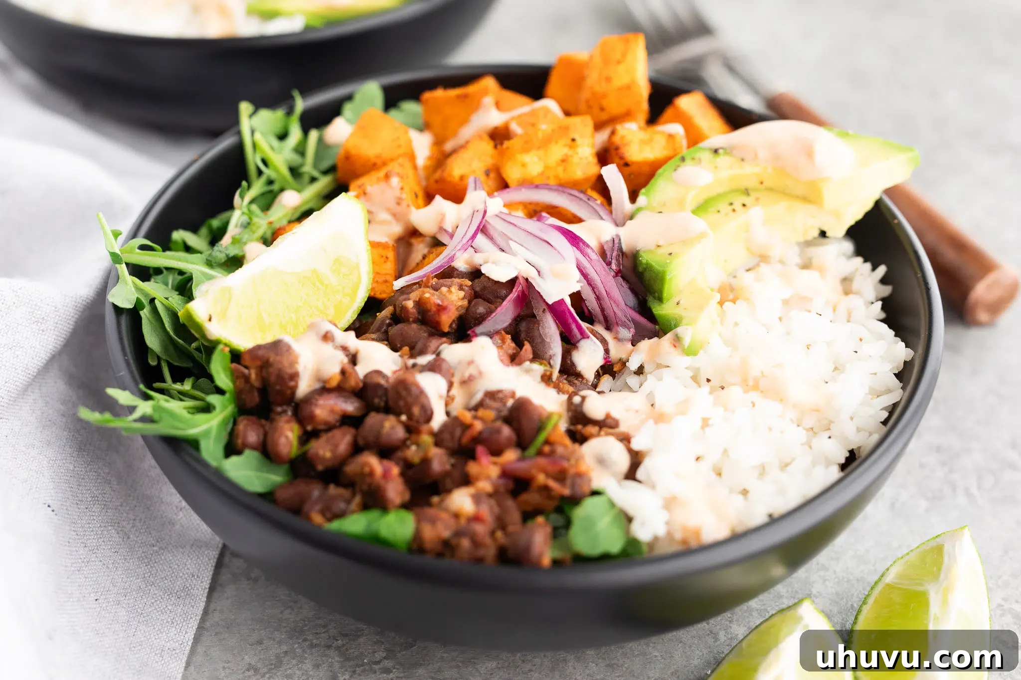 Vibrant Sweet Potato Black Bean Bowls 3 roasted sweet potato and black bean bowls in a close up