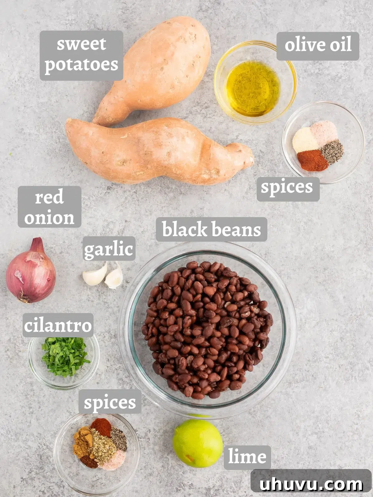 Vibrant Sweet Potato Black Bean Bowls 4 sweet potatoes, black beans and spices on a board
