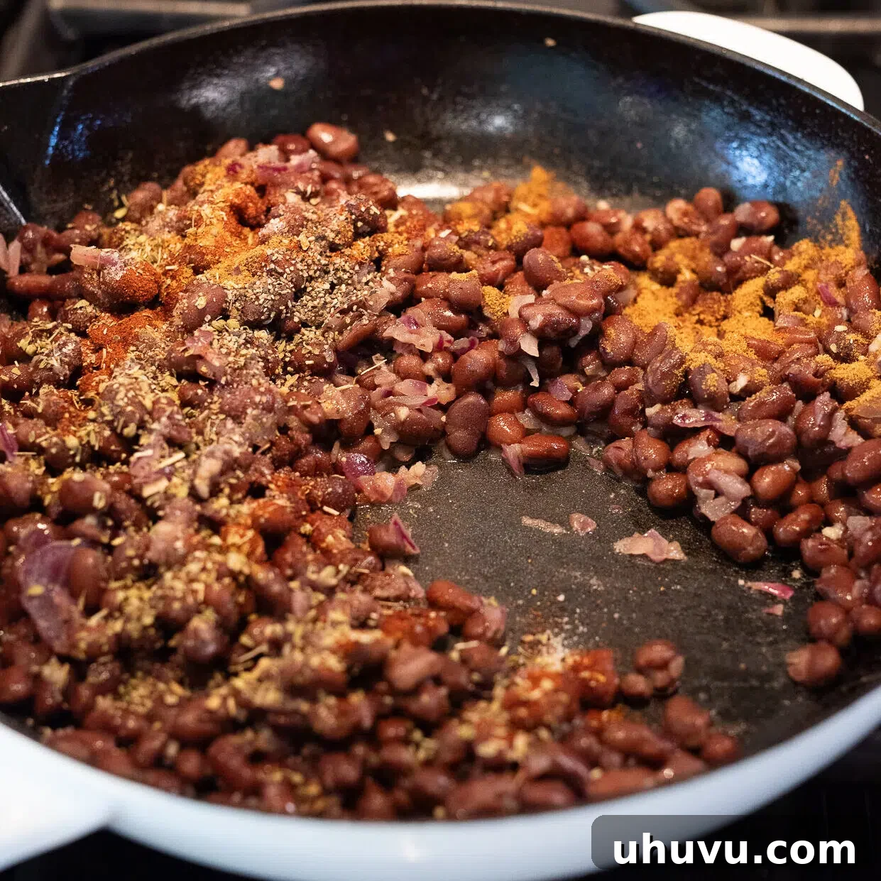 Vibrant Sweet Potato Black Bean Bowls 7 sauteed seasoned black beans in a skillet