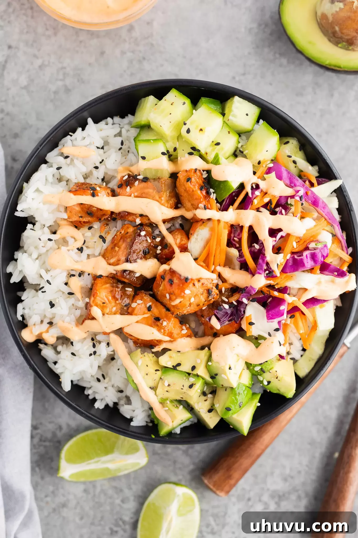 Flavorful salmon rice bowl with vibrant veggies and a drizzle of spicy mayo, ready in minutes.