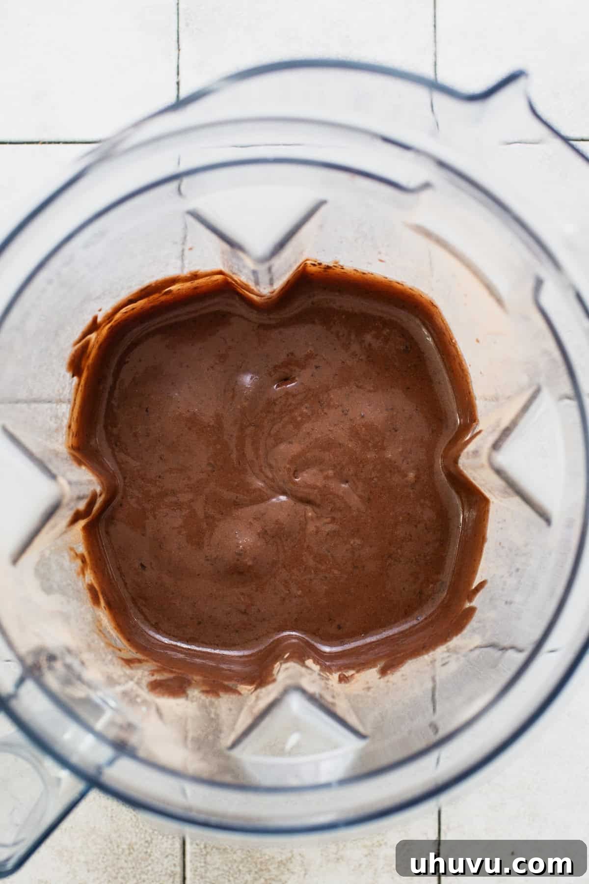 Wholesome Fudgy Black Bean Brownies 5 The smooth, rich batter for black bean brownies, perfectly blended and ready for baking, swirled within the blender pitcher.