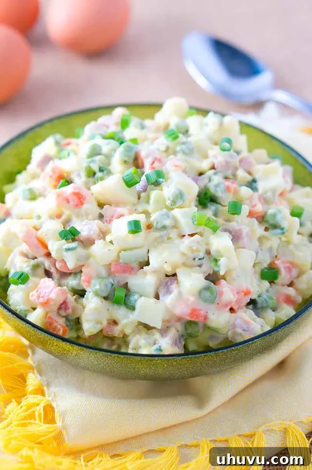 Russian Salad Olivier served in a green bowl