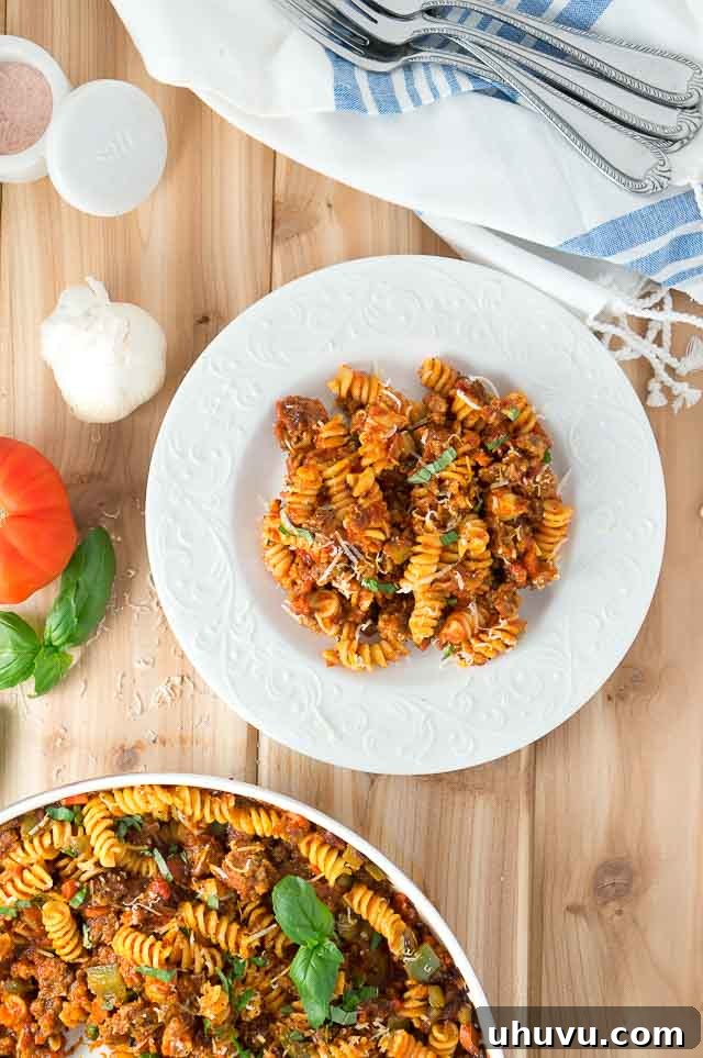 Italian Sausage and Peppers Pasta Skillet served with fresh basil