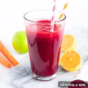 apple beets and carrots juice in a glass