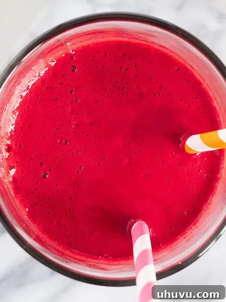 stirring abc juice in a glass