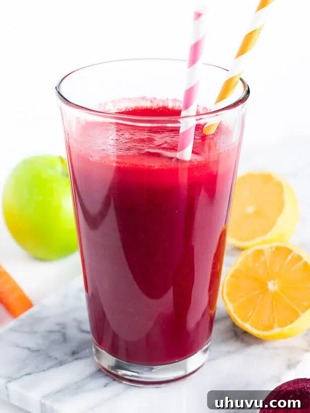 apple beets and carrots juice in a glass