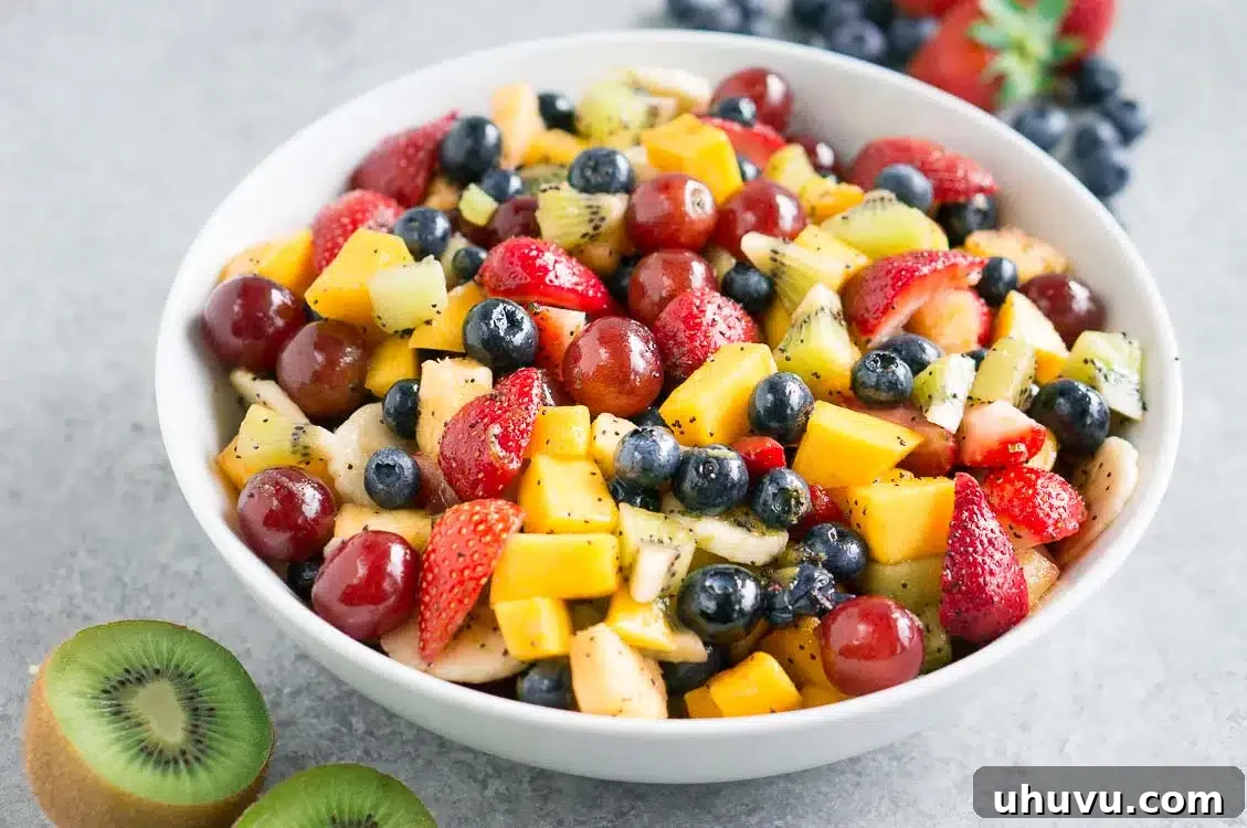 A large bowl of healthy fruit salad, beautifully arranged