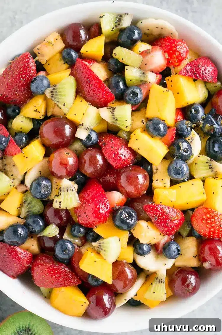 A close-up of a homemade fruit salad in a large bowl