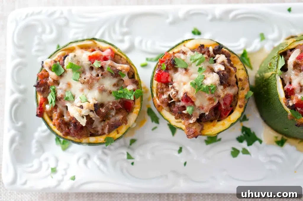 Overhead view of Stuffed Zucchini Cups arranged on a baking sheet, ready for the oven