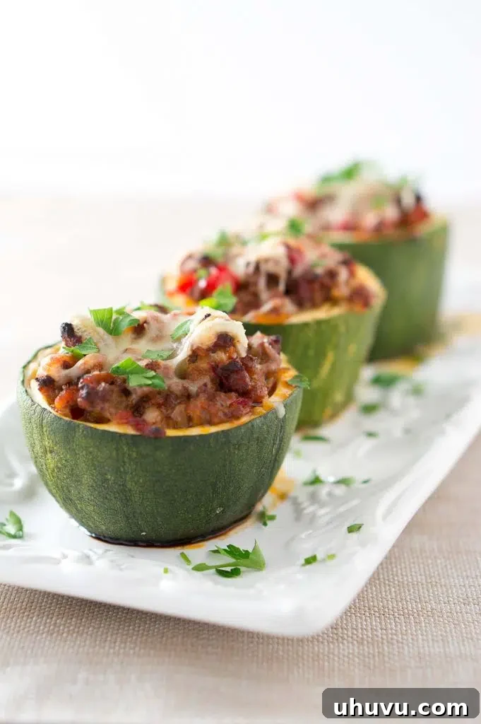 Plate of baked Stuffed Zucchini Cups with golden melted cheese, ready to eat