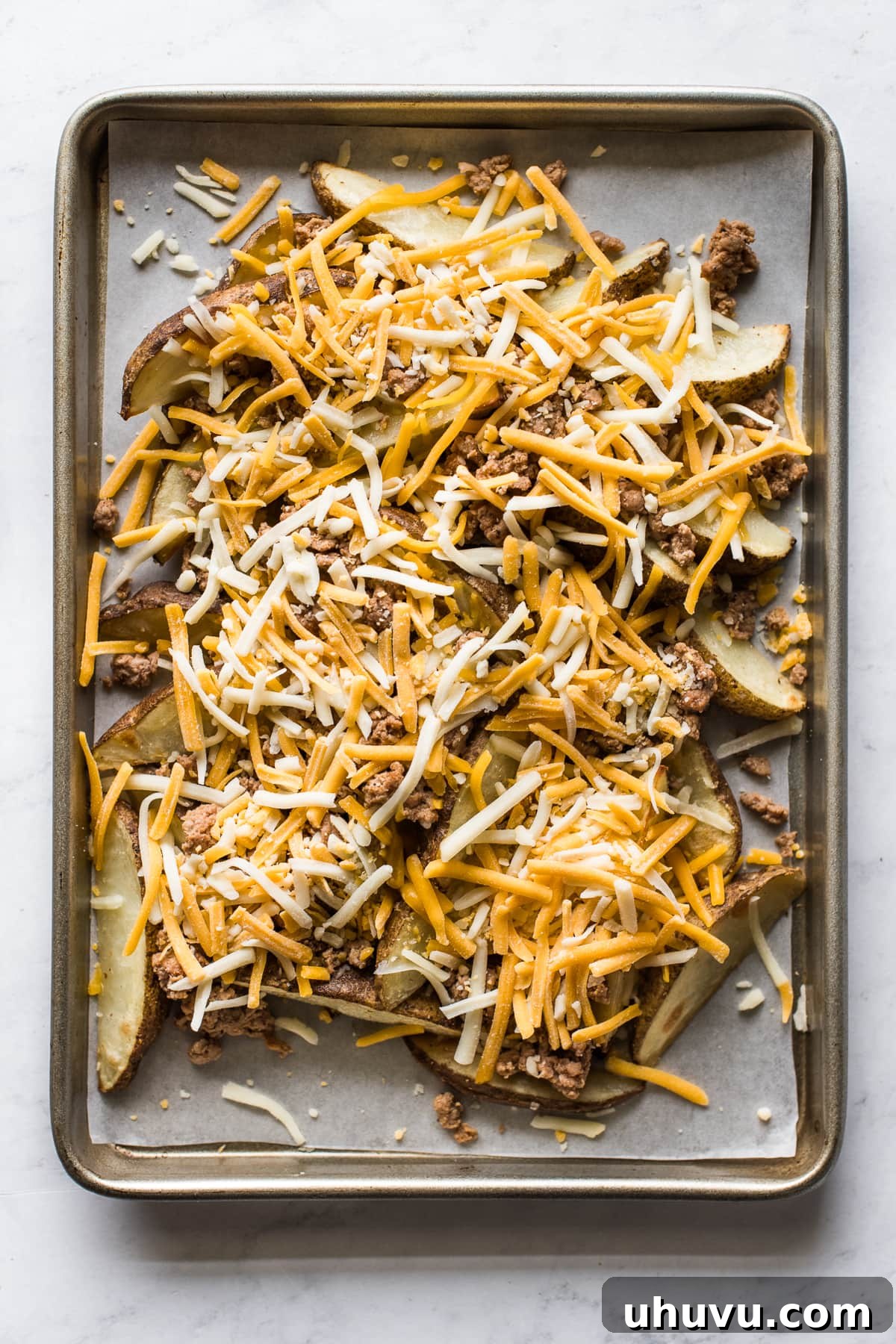 Loaded Nacho Potato Wedges 5 Baked potato wedges topped with shredded cheese.