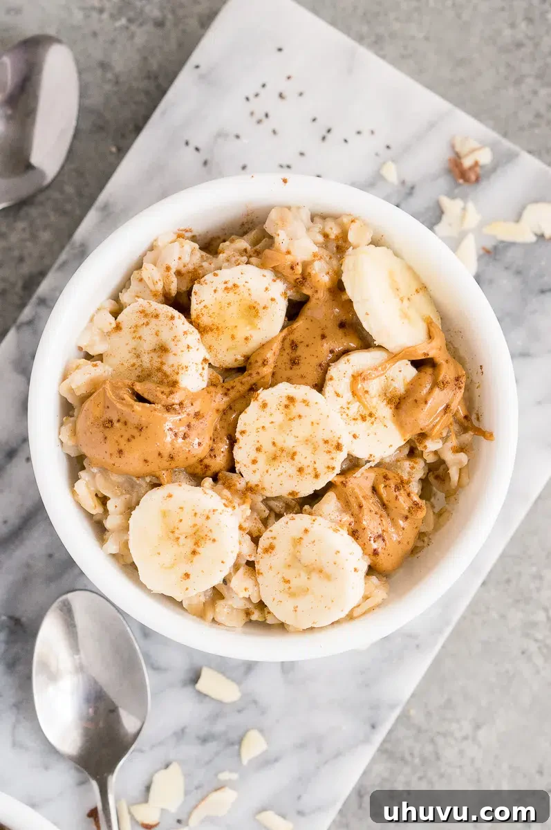 oatmeal topped with banana slices, peanut butter and cinnamon
